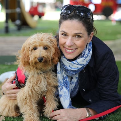 If you want to live the best life you can, Justine Campbell (above, with her therapy dog, Mintie) recommends having self-compassion, and acknowledging your problems, but not dwelling on them.