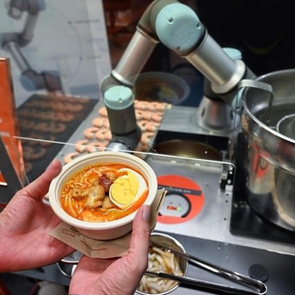 Sophie the robotic chef can serve up a piping hot bowl of laksa in under a minute. Photo: AFP