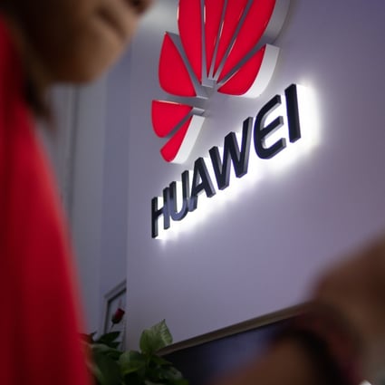 A Huawei logo is displayed at a retail store in Beijing, 2019. Photo: AFP