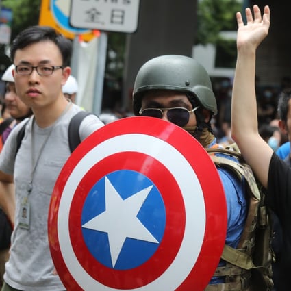 A man wielding a Captain America shield joins protesters blockading roads leading to the Hong Kong government headquarters in Tamar, Admiralty, on June 12. Photo: Dickson Lee