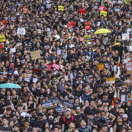Protesters march from Victoria Park in Causeway Bay to the Central Government Offices in Tamar against the extradition bill on July 1, 2019. Photo: Felix Wong