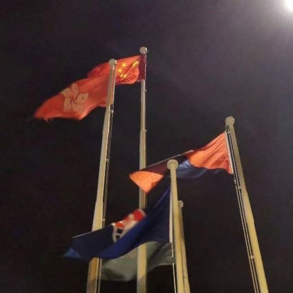 The Chinese national flag flies over Tsim Sha Tsui in Hong Kong on Saturday night. Photo: Huanqiu.com