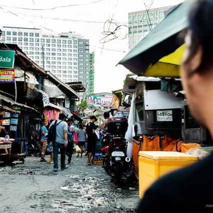 Stalls that sell everything from bread to children’s toys pepper the narrow streets of San Roque in Metro Manila in the Philippines. The neighbourhood is under threat of demolition to make way for a commercial development. Photo: Maro Enriquez