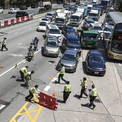 Anti-government protesters stage a roadblock at the Hung Hom Cross-Harbour Tunnel, causing a major disruption to the transport network in Hong Kong on Monday. Photo: Felix Wong