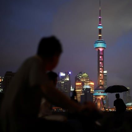 Pedestrians look at the Shanghai skyline on July 19. International talent, including international students, have become a key ingredient for China’s high-quality growth. Photo: Reuters