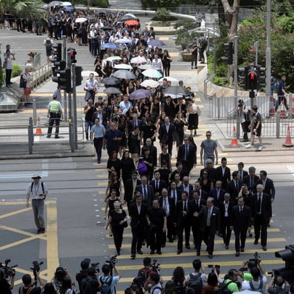 Members of the city’s legal profession march in silence from Chater Garden to the Department of Justice. Photo: Sam Tsang