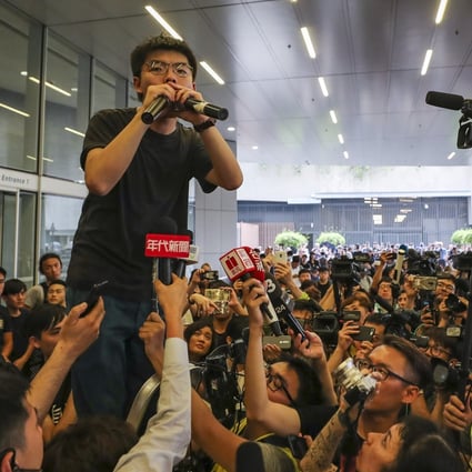 Joshua Wong is the centre of attention as he speaks to protesters against extradition law changes in Hong Kong a day after his release from prison. Photo: Sam Tsang