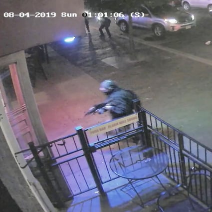 A screen grab from a surveillance video shows several officers (top left and right) firing at and killing Connor Betts (bottom left at doorway) seconds after he began killing people outside a bar in Dayton, Ohio. Photo: Dayton Police Department via EPA-EFE