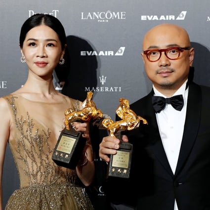 Actors Hsieh Ying-xuan and Xu Zheng pose after winning top honours at the Golden Horse awards in 2018. Xu, from mainland China, won the award for his role in the box-office hit Dying to Survive. Photo: Reuters
