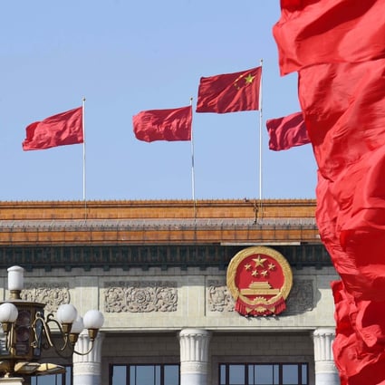 Fluttering flags at the Tiananmen Square and atop the Great Hall of the People in Beijing on March 5, 2019. Photo: Xinhua