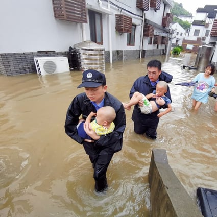 Policemen helping people stranded by floods in Zhoushan City, a part of China’s Zhejiang Province, on Saturday. Typhoon Lekima, the ninth of the year, made landfall in Wenling City. Photo: Xinhua