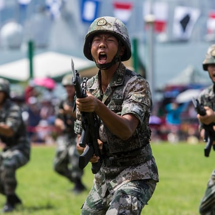 Chinese soldiers take part in a drill open to the public at the Stonecutters Island naval base in Hong Kong on June 30, to mark the 22nd anniversary of the handover of Hong Kong. Photo: AFP