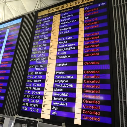 An electronic board shows all departing flights cancelled, as anti-government protesters bring Hong Kong International Airport to a grinding halt. Photo: Felix Wong