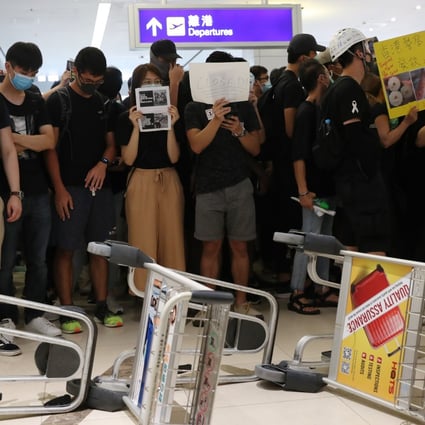 Anti-government protesters at Hong Kong International Airport paralysed one of the world’s busiest aviation hubs for a second consecutive day on Tuesday. Photo: Sam Tsang