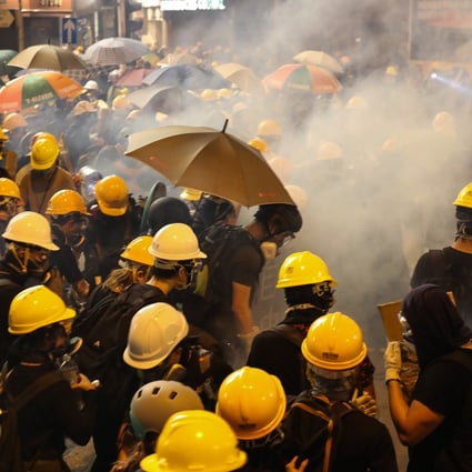 Tear gas is fired at anti-government demonstrators during a clash in Yuen Long last month. The protests are in their tenth week. Photo: EPA-EFE