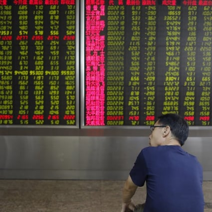 A Chinese investor watches stock prices in Beijing on August 2, 2019. Photo: EPA-EFE