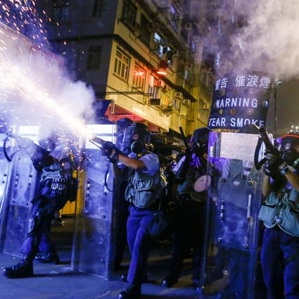 Police fire tear gas at pro-democracy protesters during clashes in Sham Shui Po in Hong Kong on Wednesday. Photo: Reuters