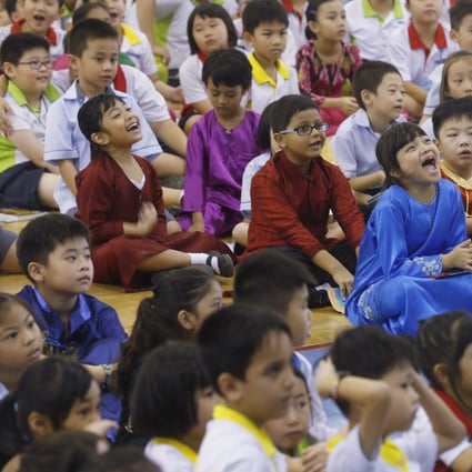 School pupils in Singapore wear traditional costumes on Racial Harmony Day. Photo: Kevin Lim