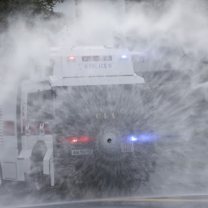 Police demonstrate a water cannon at the Police Tactical Unit compound in Fanling on Monday. Photo: Sam Tsang