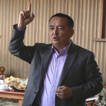 Activist Serikjan Bilash speaks to a crowd of Kazakhs at a restaurant in Almaty, Kazakhstan in March 2018. Photo: AP
