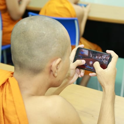 A novice monk takes part in the KKU Nong Khai Fair Speed Drifter competition. Photos: Facebook