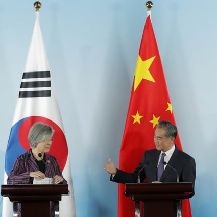 Chinese Foreign Minister Wang Yi gestures to his South Korean counterpart Kang Kyung-wha at a press conference with their Japanese counterpart Taro Kono. Photo: AP