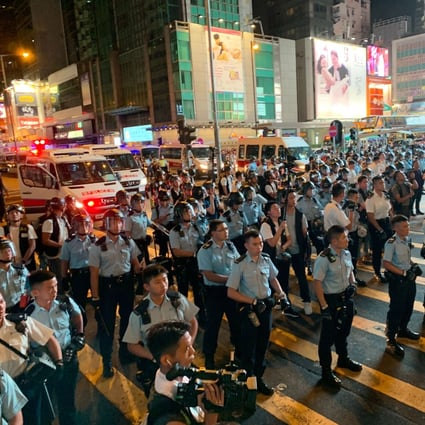 Confrontation outside the Bank Centre in Mong Kok on 7 July 2019 as protesters marching from Tsim Sha Tsui through Nathan Road arrive at Mong Kok. Photo: SCMP/Dickson Lee