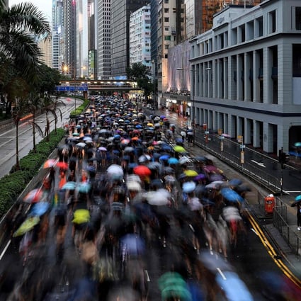 Protesters on the march during a rally in Hong Kong on August 18. The water represented by a Pig year could have been a boon for Hong Kong, a Wood Dragon, but there is such a thing as too much water. Photo: AFP