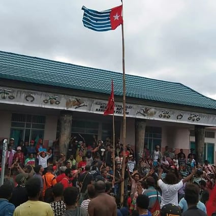 Protesters gather under the banned West Papuan flag in the city of Fakfak. Photo: AFP
