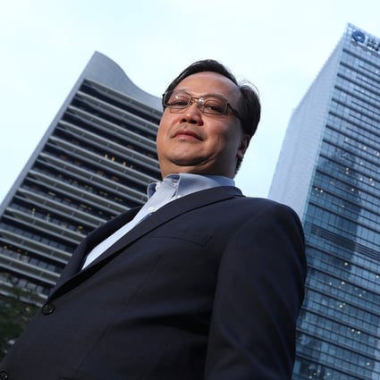 RRJ Capital chairman Richard Ong in front of CCB Tower in Central. Photo: Nora Tam