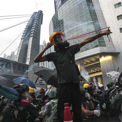 Anti-government protesters clash with police in Tsuen Wan on Sunday. Photo: Sam Tsang