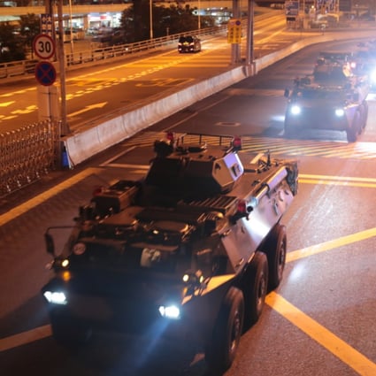 PLA military vehicles pass into Hong Kong at Huanggang Port in the early hours of Thursday. Photo: Xinhua