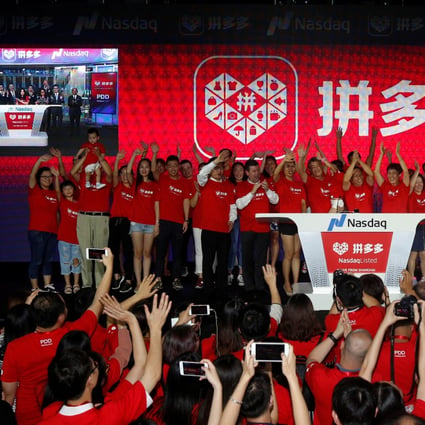 Users of online group discounter Pinduoduo wave after ringing the opening bell on the Nasdaq Stock Market in New York during an event in Shanghai, China July 26, 2018. Photo: Reuters