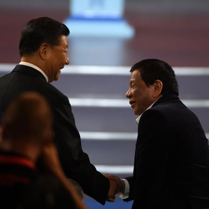 Xi Jinping (left) shakes hands with Rodrigo Duterte during the opening ceremony of the 2019 Basketball World Cup in Beijing on Friday. Duterte is on his fifth visit to China as president. Photo: AFP