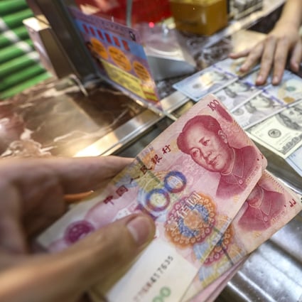 Many banks are adjusting their forecasts for the yuan in the light of its depreciation after more than a year of trade war with the US. Photo: Roy Issa
