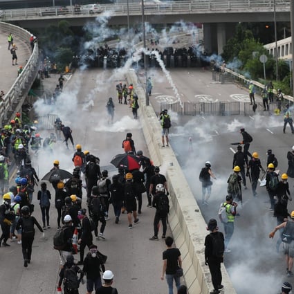 Riot police fire rounds of tear gas towards anti-government protesters in Kwun Tong, Hong Kong on August 24. Photo: Sam Tsang