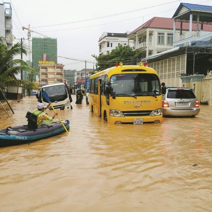 Submerged cars, buses and motorbikes were abandoned throughout the city during heavy flooding in Sihanoukville, Cambodia, early last month. Photo: Mother Nature