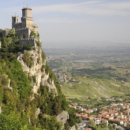 A medieval tower view looks over rural villages in the Italian countryside near San Marino in Italy. Photo: Tim Pile