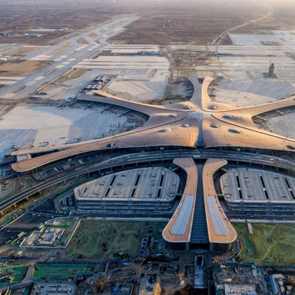 Beijing Daxing International Airport – pictured last December while under construction – was designed with the appearance of a giant six-armed alien starfish by architect Zaha Hadid and opens in September. Photo: Chinatopix/AP