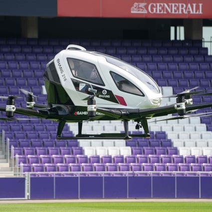 The two-seater Ehang 216, an electric-powered autonomous flying taxi, takes a short flight during its launch in April this year at Generali Arena in Vienna, Austria. Photo: Agence France-Presse