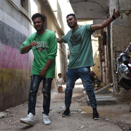 Rappers Mohammad Omar (right) and Wasim Masih perform in Lyari, one of Pakistan’s most dangerous neighbourhoods. Photo: AFP