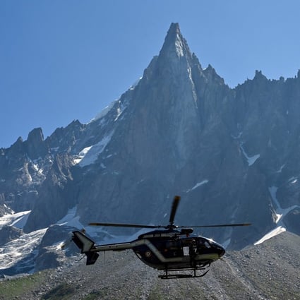 A helicopter flies over the Mont Blanc Massif - the mayor worries they will need a helicopter to remove a rowing machine left by a ‘wacko’ on Mont Blanc. Photo: Philippe Desmazes/AFP