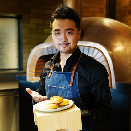 Vince Lu, founder of plant-based alternative meat company Zhenmeat, showcasing mooncakes made with his company’s products.