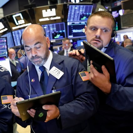 Traders work on the floor at the New York Stock Exchange on Thursday. Photo: Reuters