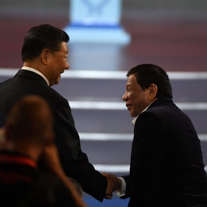 China's President Xi Jinping (left) shakes hands with Philippine President Rodrigo Duterte during the opening ceremony of the 2019 Basketball World Cup in Beijing on August 30. Photo: AFP