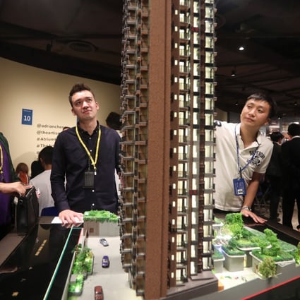 Potential buyers view a model of New World Development’s Atrium House, Tsuen Wan, in June. Ever-increasing property prices beyond the reach of most Hongkongers, while the government sits on a massive pile of reserves, have been a major cause of Hong Kong’s discontent. Photo: Xiaomei Chen