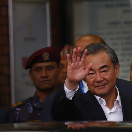 Wang Yi, pictured arriving in Nepal on Sunday, says China firmly supported the Pakistani government. Photo: DPA