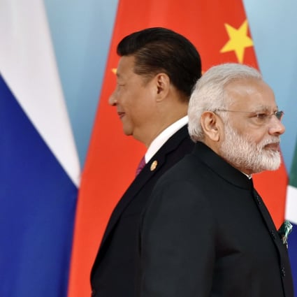 Xi Jinping and Narendra Modi at a conference in southwest China two years ago. Photo: AFP
