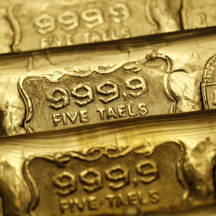 Five-tael (6.65 ounces or 190 grams) gold bars are seen at a jewellery store in Hong Kong. Gold prices have risen in recent months. Photo: Reuters