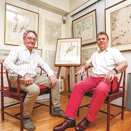Robert Nield (left) and Jonathan Wattis with a selection of historical maritime maps on show at Wattis Fine Art in Hong Kong’s Central district. Nield is selling much of his collection of maps and charts. Photo: Jonathan Wong